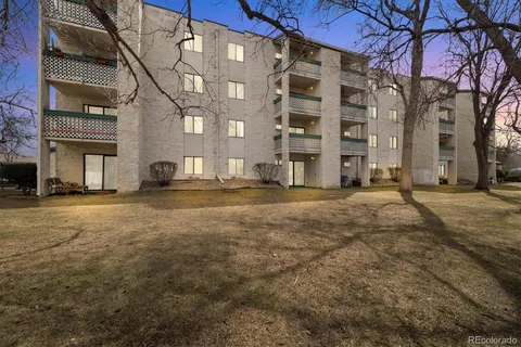 a view of a building with a yard