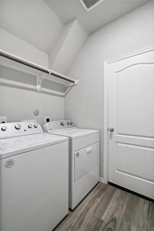 a utility room with dryer and washer