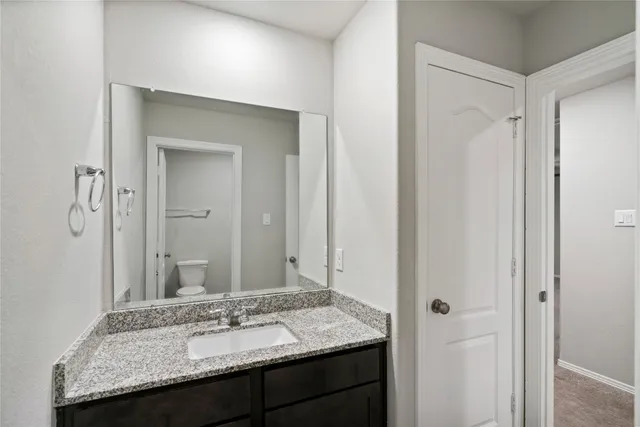 a bathroom with a toilet and bathtub