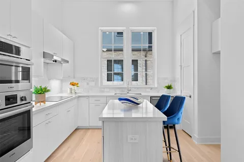 a kitchen with a sink and cabinets