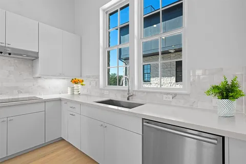 a kitchen with a sink and window