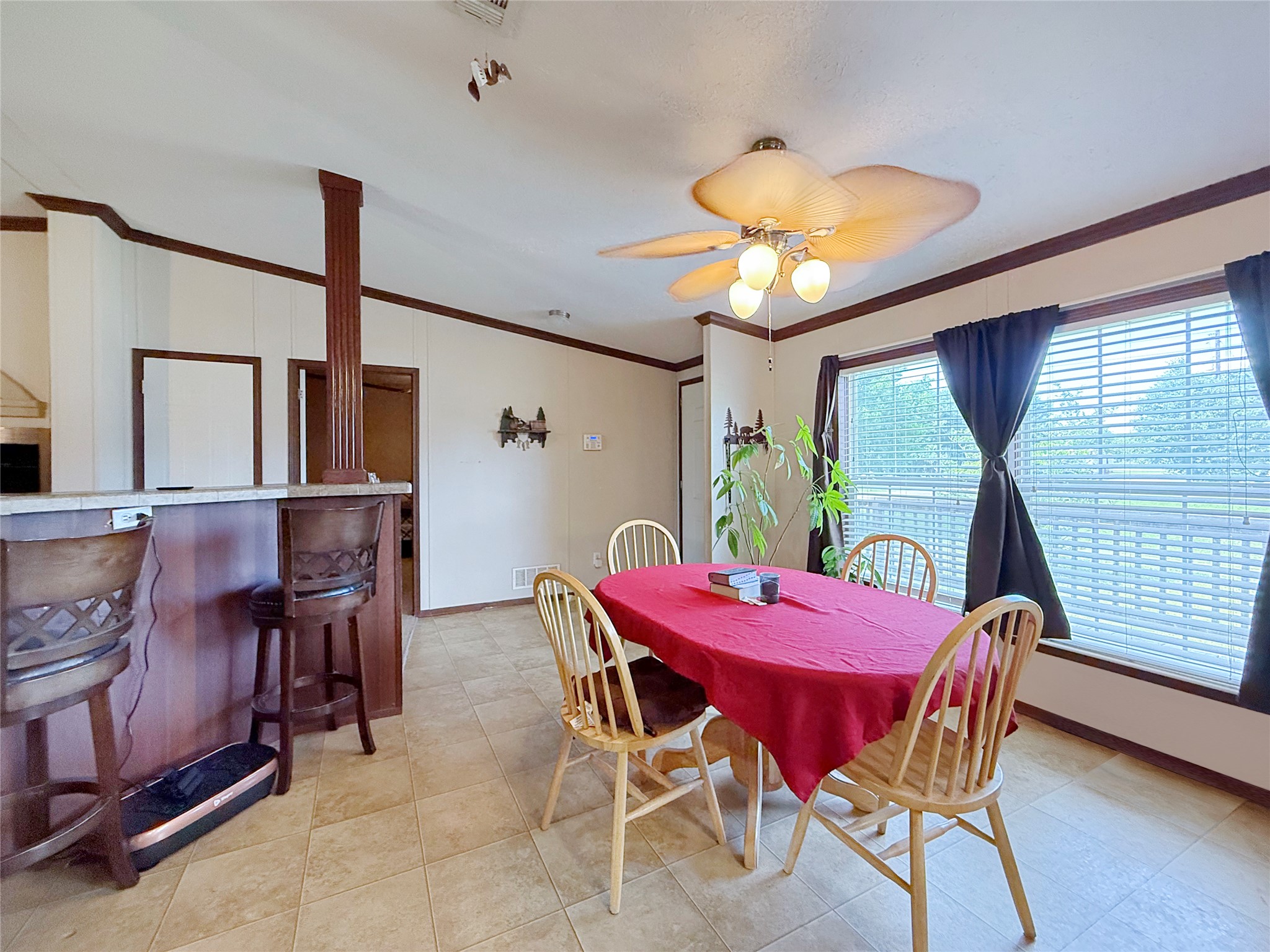 845 Caldwell Street Lexington, TX 78947 - Photo 4 of 39 Dining room featuring ornamental molding, ceiling fan, and baseboards