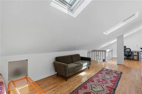 a living room with furniture and a rug