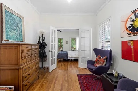 a bedroom with furniture and a window