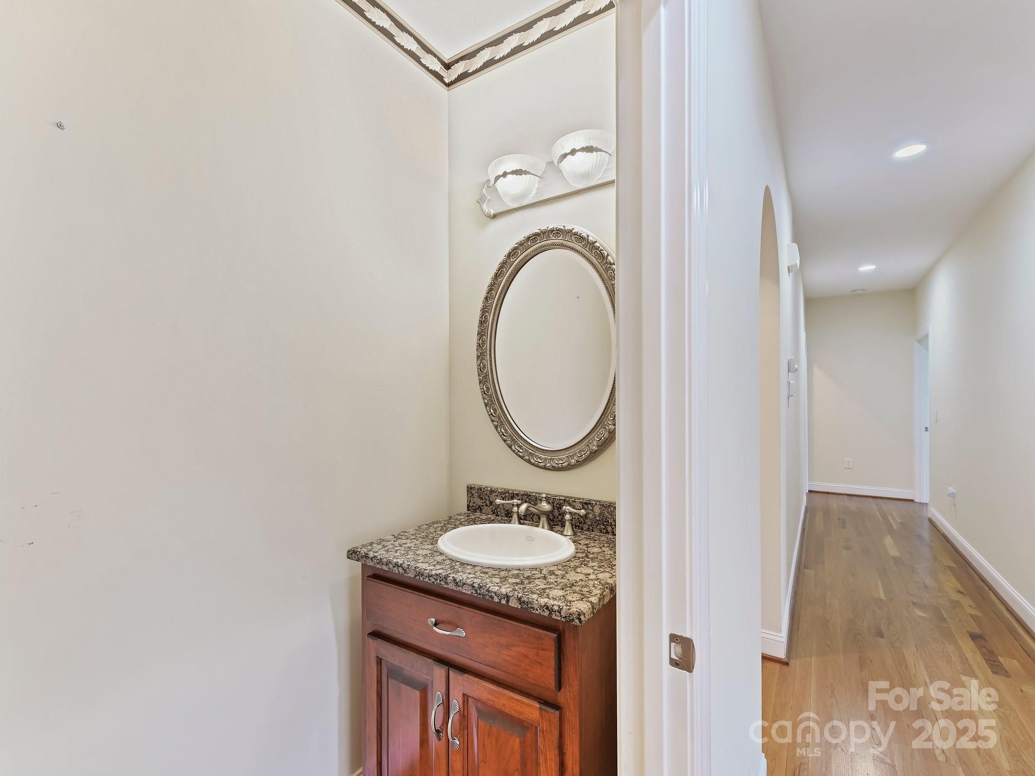 1902 Windmere Drive Monroe, NC 28110 - Photo 15 of 47 a bathroom with a granite countertop sink and a mirror