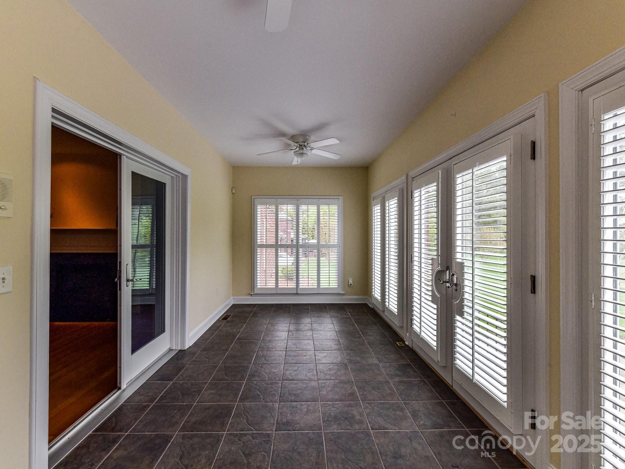 1902 Windmere Drive Monroe, NC 28110 - Photo 18 of 47 a view of an empty room with glass door