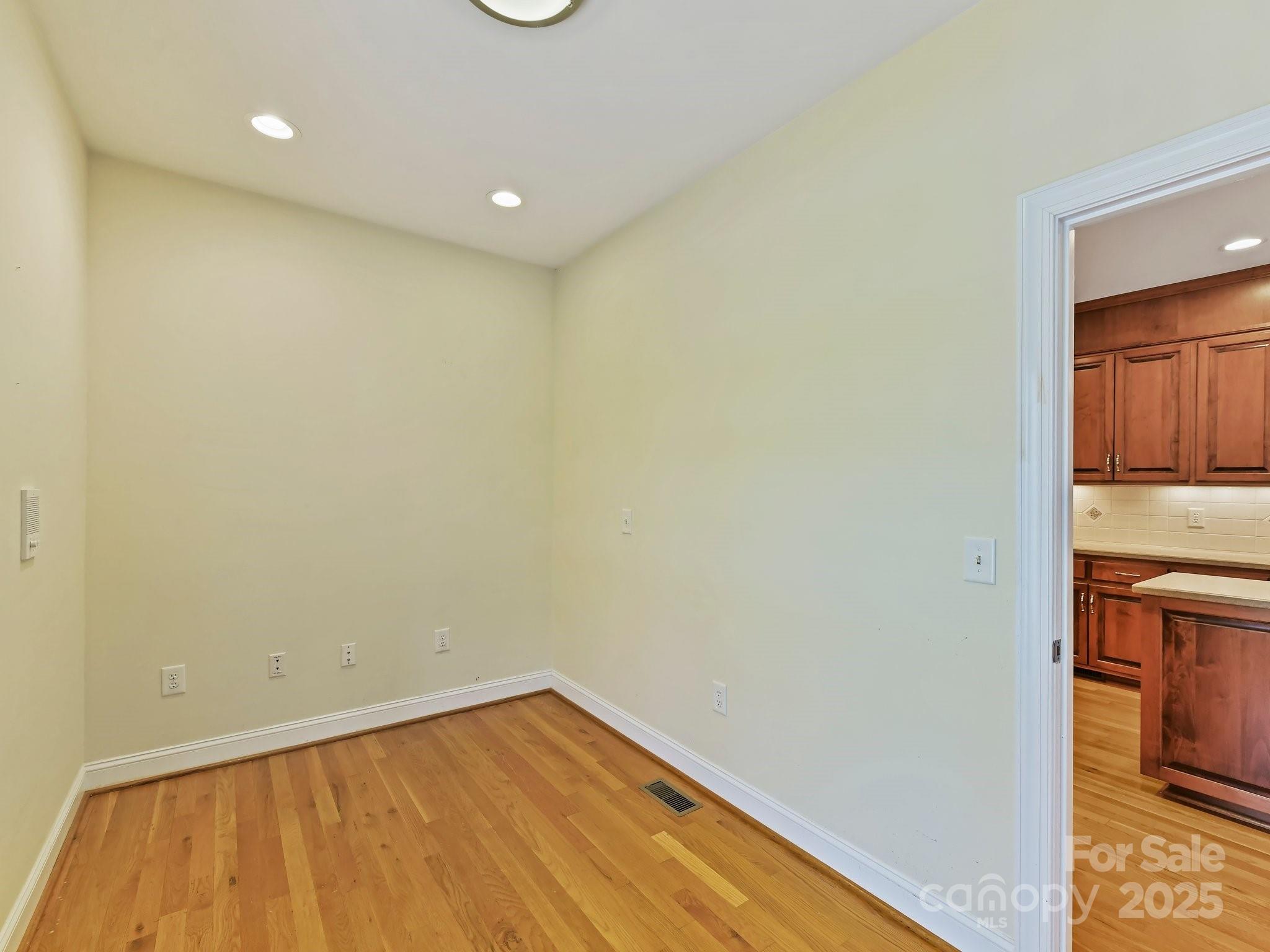 1902 Windmere Drive Monroe, NC 28110 - Photo 19 of 47 a view of a room with wooden floor and a sink