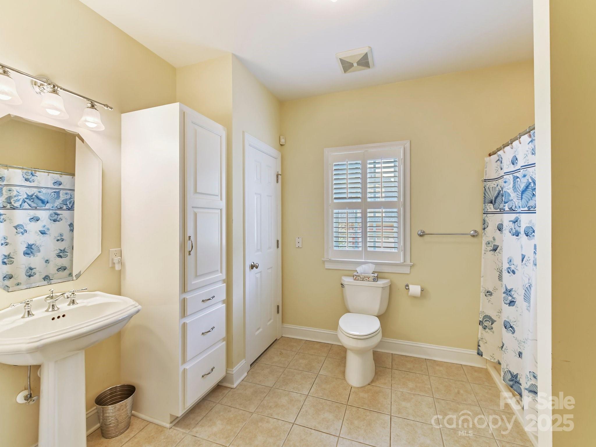 1902 Windmere Drive Monroe, NC 28110 - Photo 26 of 47 a bathroom with a toilet sink and shower