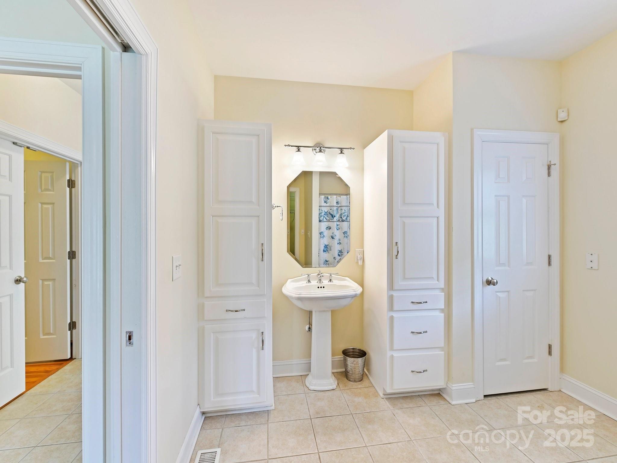 1902 Windmere Drive Monroe, NC 28110 - Photo 27 of 47 a bathroom with a sink a mirror and shower