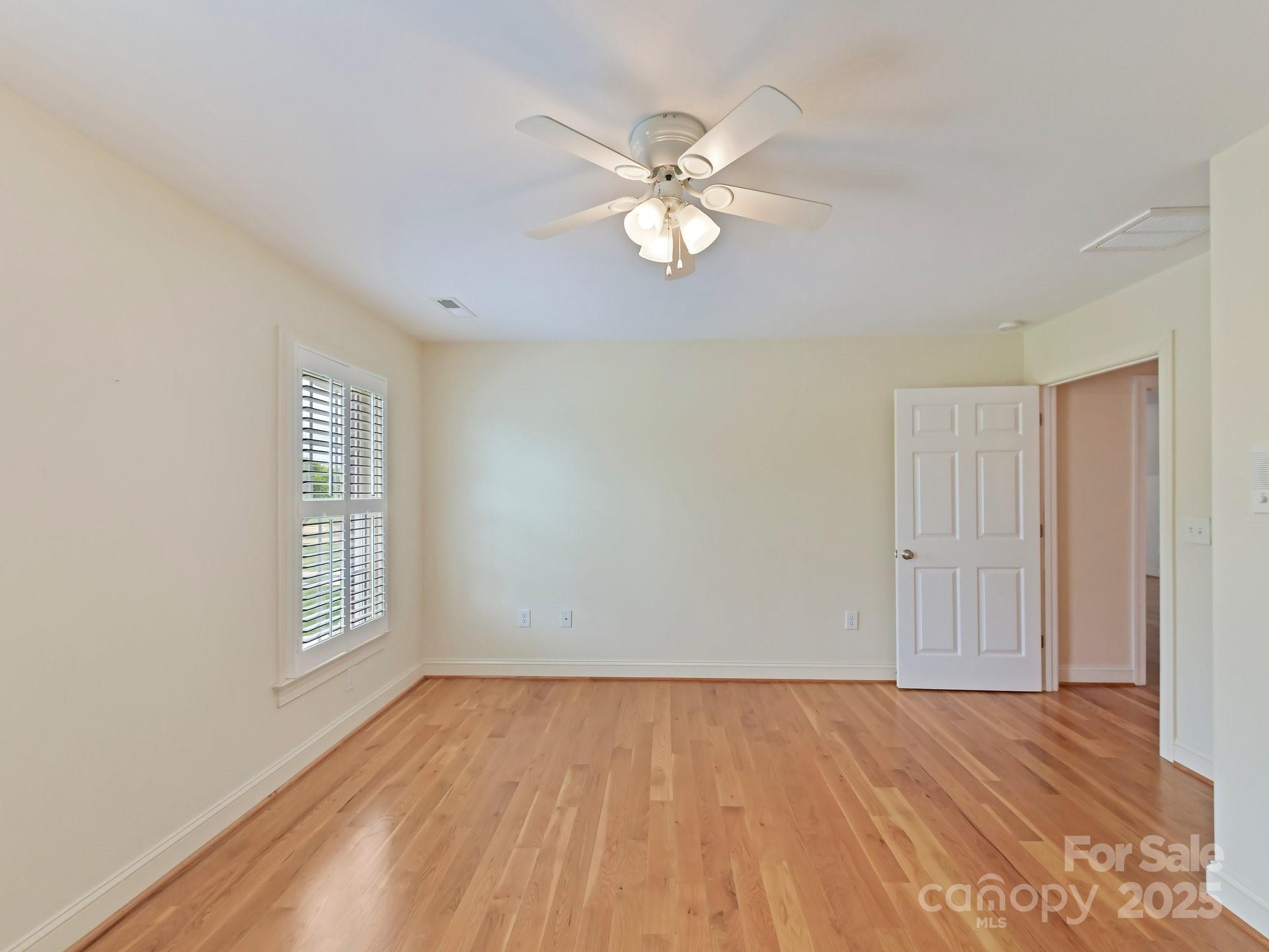 1902 Windmere Drive Monroe, NC 28110 - Photo 36 of 47 a view of an empty room with wooden floor and a window