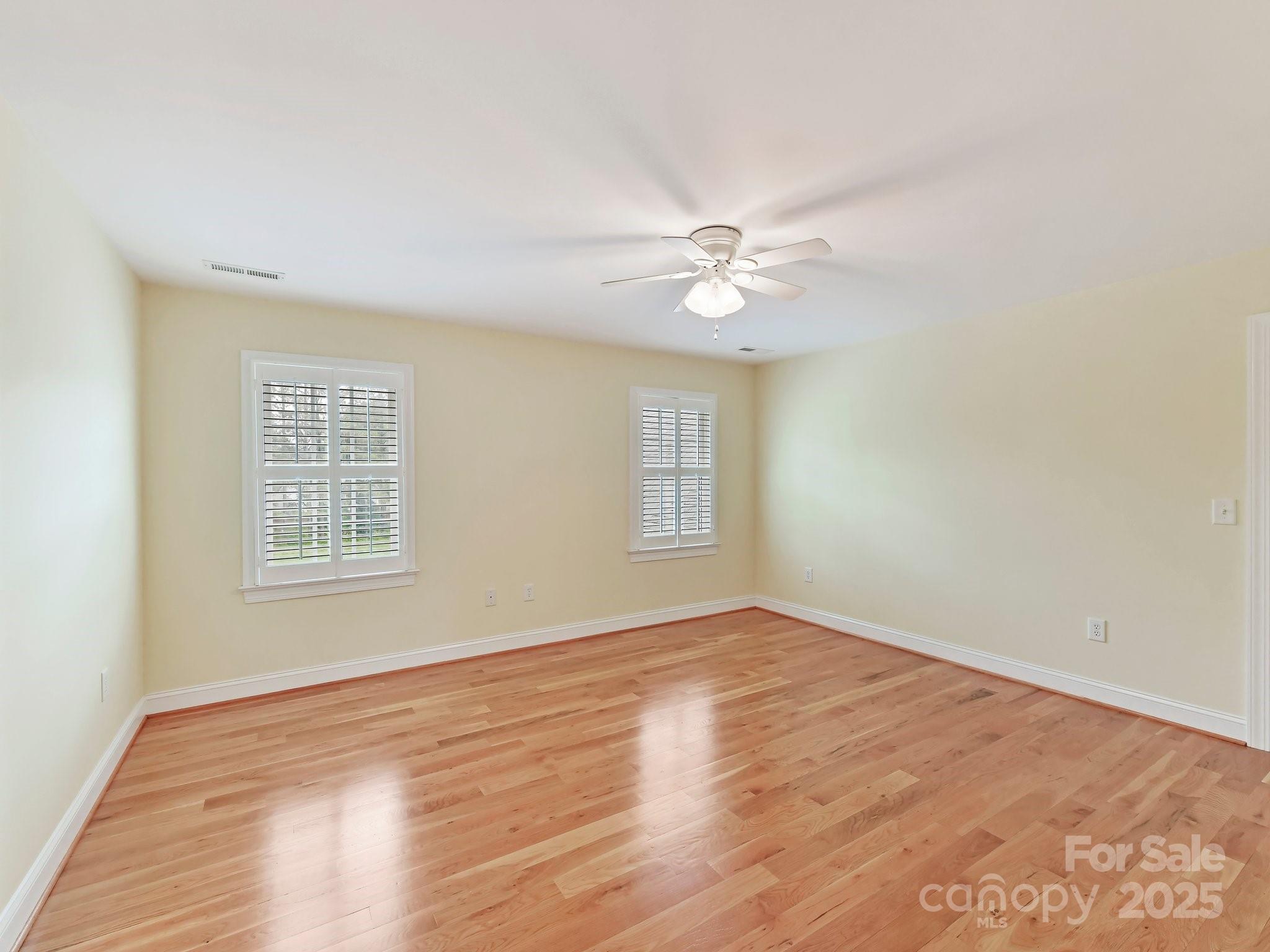 1902 Windmere Drive Monroe, NC 28110 - Photo 37 of 47 wooden floor in an empty room with a window