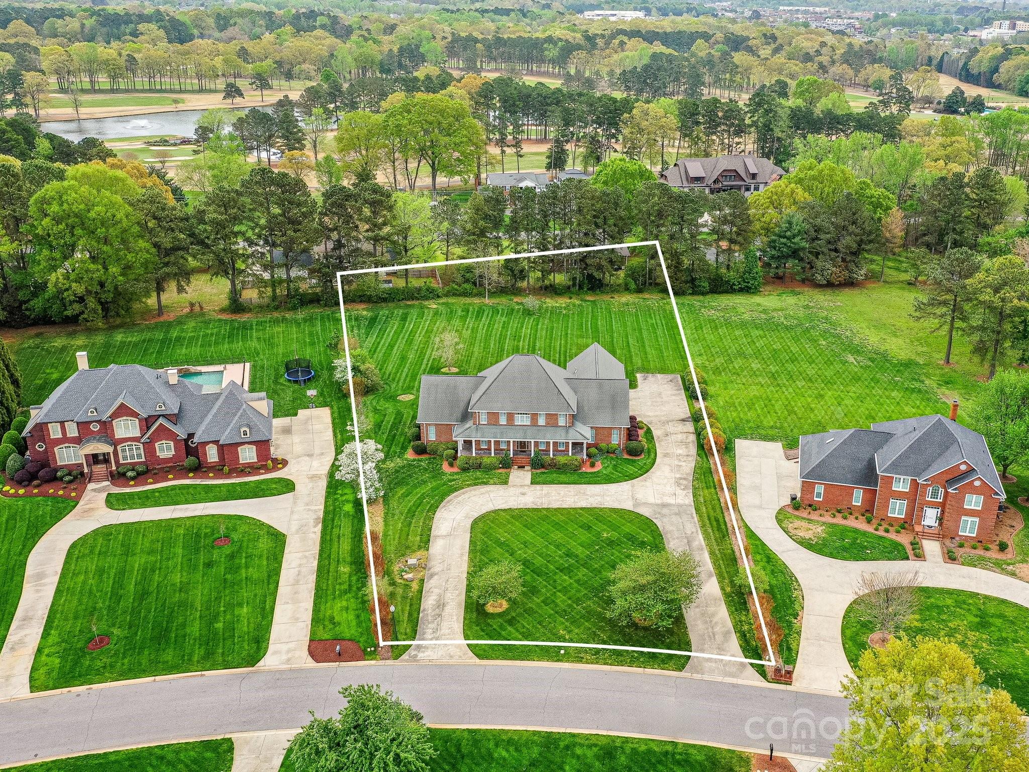 1902 Windmere Drive Monroe, NC 28110 - Photo 44 of 47 a two chairs sitting in the middle of a park