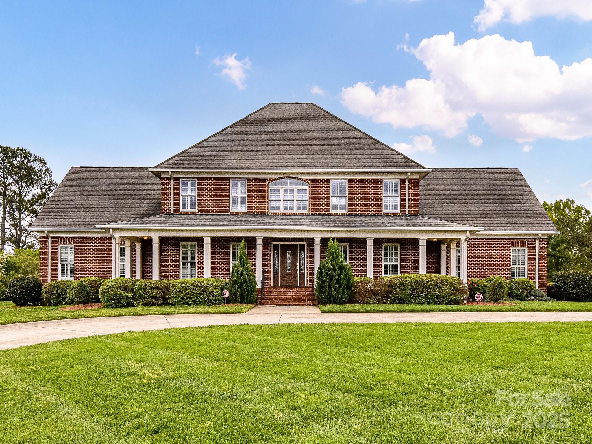 1902 Windmere Drive Monroe, NC 28110 - Photo 47 of 47 a front view of a house with a garden and plants