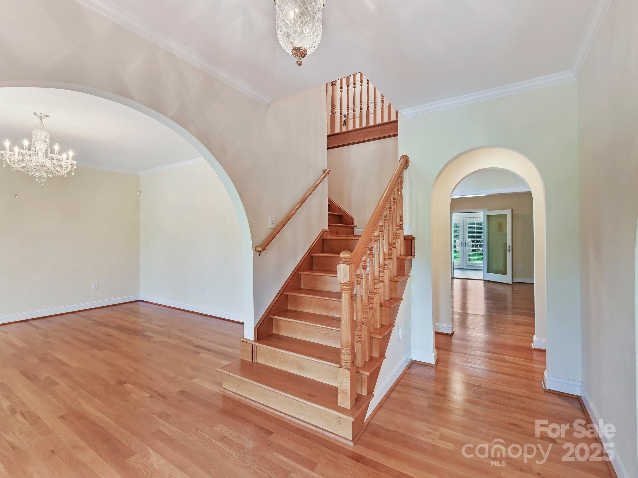 1902 Windmere Drive Monroe, NC 28110 - Photo 8 of 47 a view of a livingroom with wooden floor and stairs