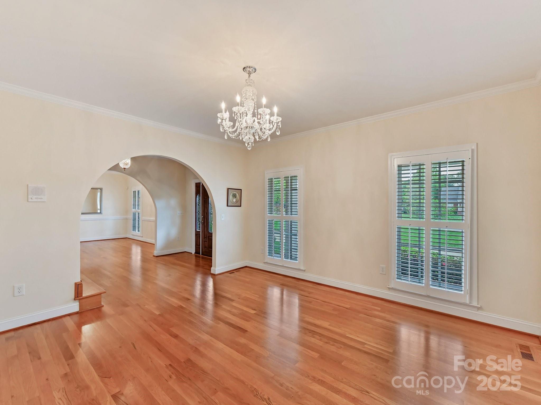 1902 Windmere Drive Monroe, NC 28110 - Photo 9 of 47 a view of empty room with wooden floor and fan