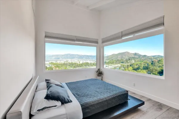 a room with a bed and a window