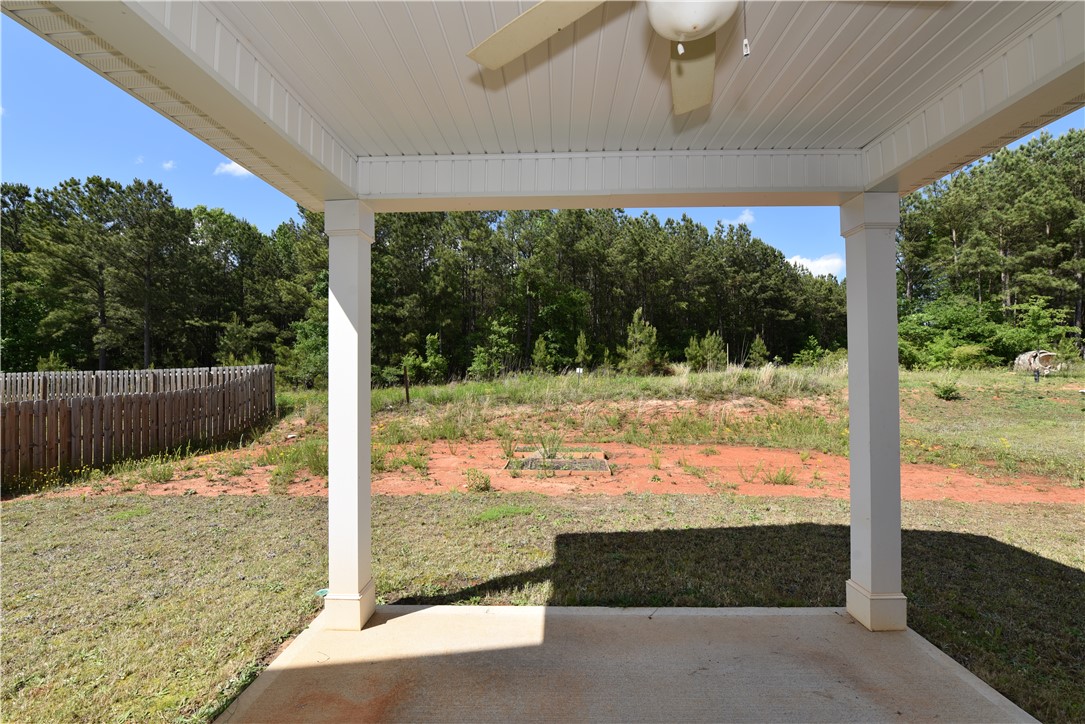 122 Bellflower Lane Anderson, SC 29625 - Photo 15 of 32 This covered patio offers a tranquil retreat with views of the natural landscape.