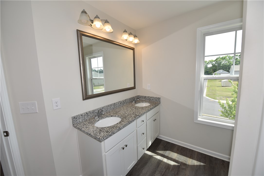 122 Bellflower Lane Anderson, SC 29625 - Photo 19 of 32 This bright bathroom features a spacious dual vanity and large window with natural light.