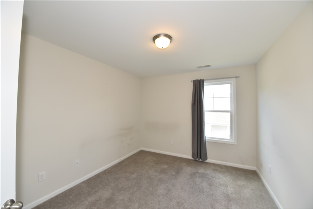 122 Bellflower Lane Anderson, SC 29625 - Photo 21 of 32 This bright room features a window with natural light and a soft carpeted floor.