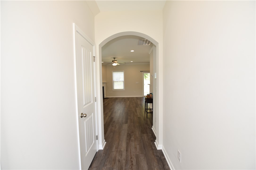 122 Bellflower Lane Anderson, SC 29625 - Photo 3 of 32 This inviting entryway features an arched doorway and durable flooring leading to sunlit living spaces.