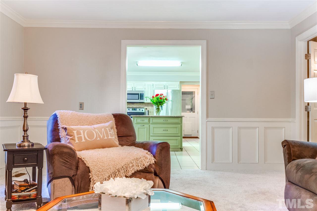 620 Downpatrick Lane Raleigh, NC 27615 - Photo 11 of 23 a bedroom with furniture and a lamp