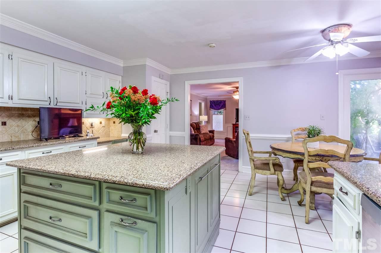 620 Downpatrick Lane Raleigh, NC 27615 - Photo 14 of 23 a view of kitchen island table and chairs