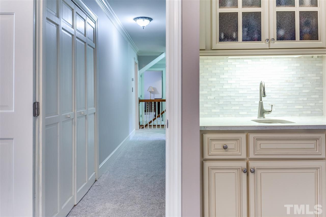620 Downpatrick Lane Raleigh, NC 27615 - Photo 16 of 23 a view of a kitchen from a hallway