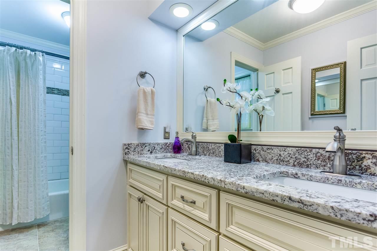 620 Downpatrick Lane Raleigh, NC 27615 - Photo 20 of 23 a bathroom with sinks and mirror