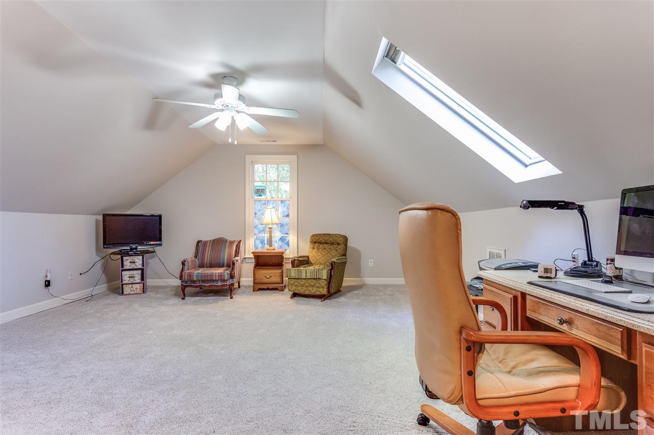 620 Downpatrick Lane Raleigh, NC 27615 - Photo 21 of 23 a room with furniture and a chandelier