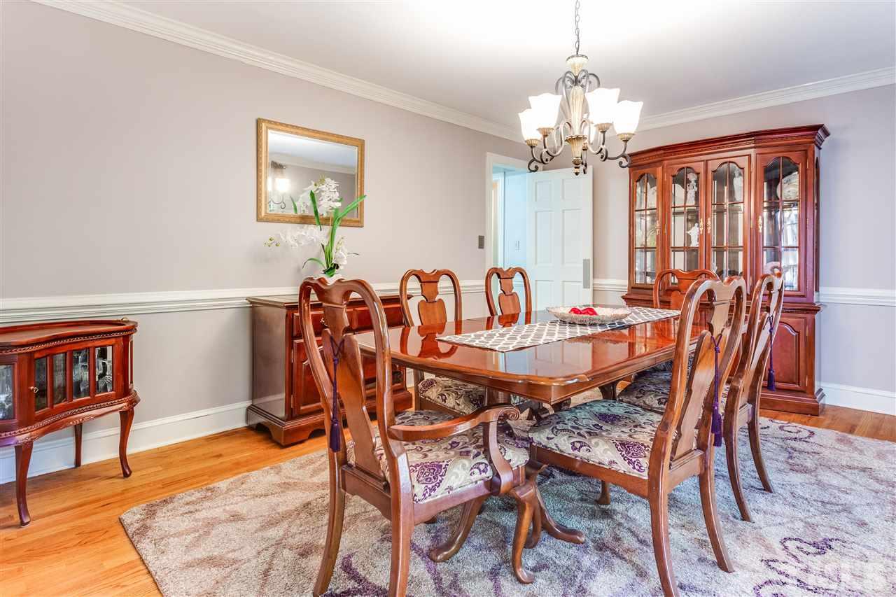 620 Downpatrick Lane Raleigh, NC 27615 - Photo 5 of 23 a view of a dining room with furniture and a chandelier