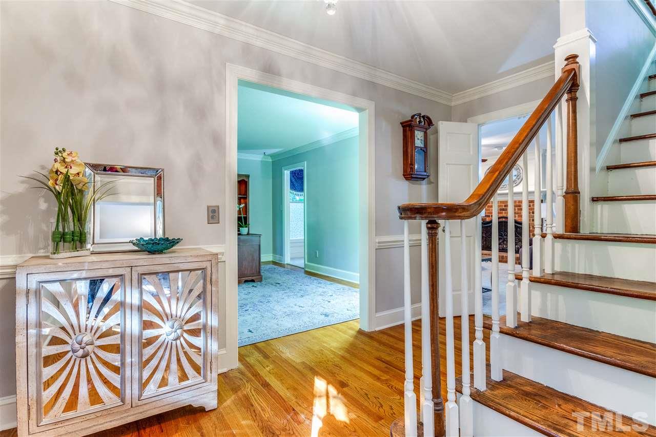 620 Downpatrick Lane Raleigh, NC 27615 - Photo 6 of 23 a view of an entryway with wooden floor and stairs