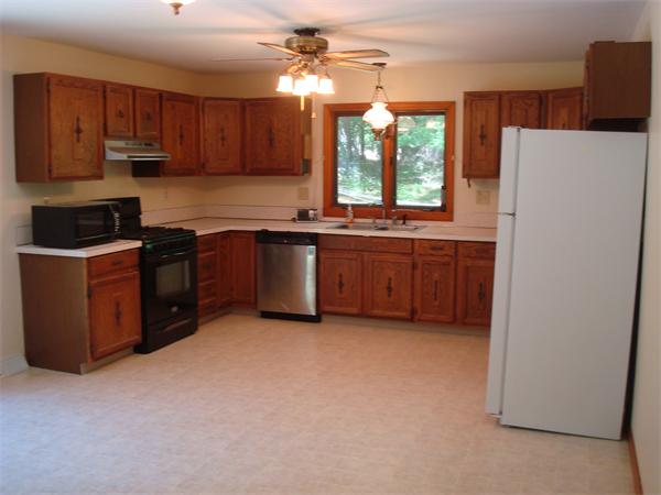 159 Old Sunderland Road Montague, MA 01351 - Photo 6 of 14 a kitchen with stainless steel appliances granite countertop a stove a refrigerator a sink and dishwasher