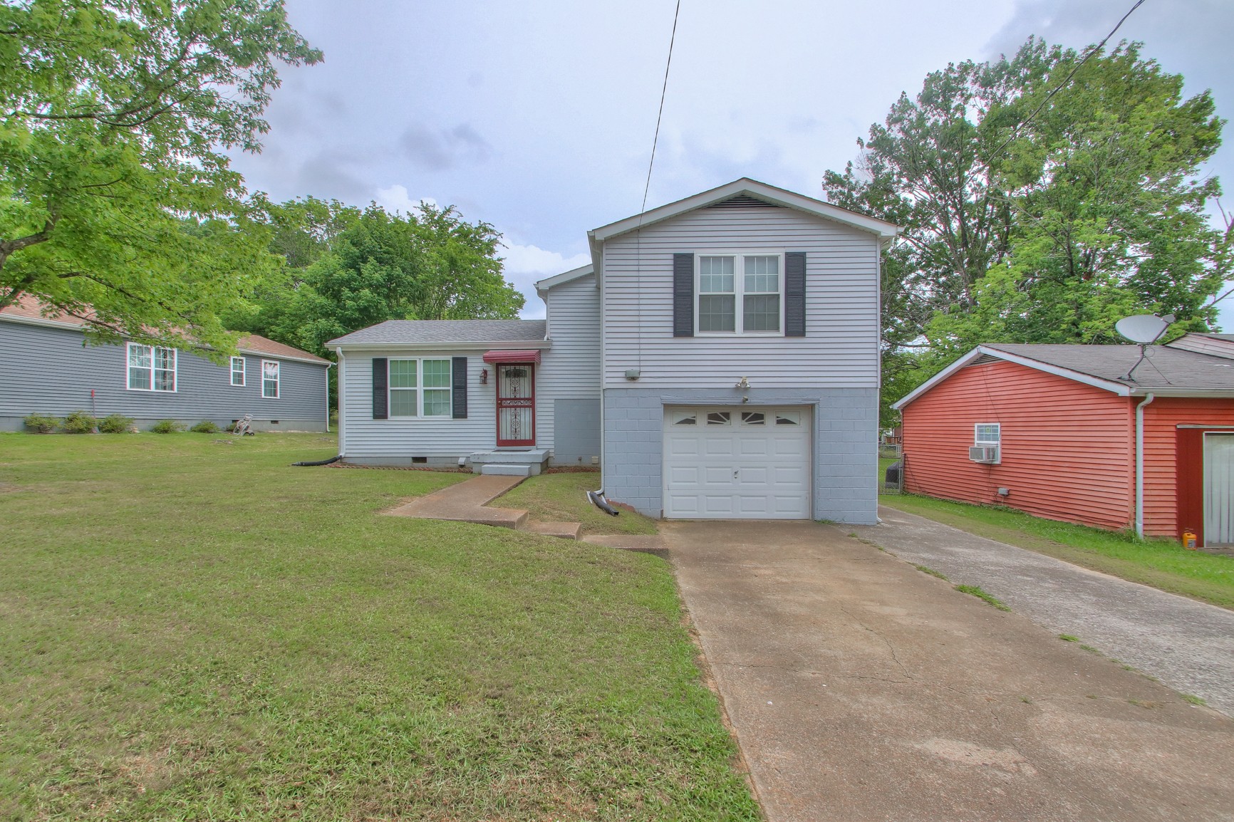 221 Warrior Road Madison, TN 37115 - Photo 3 of 13 a view of a house with a garden and yard