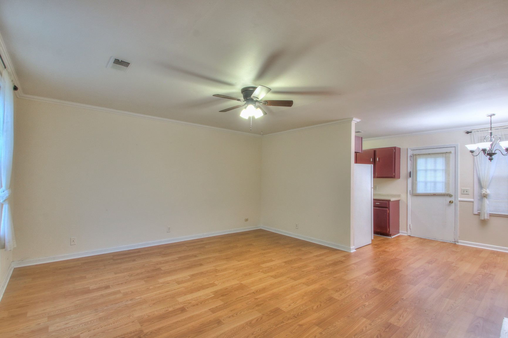 221 Warrior Road Madison, TN 37115 - Photo 4 of 13 a view of a livingroom with a ceiling fan and window