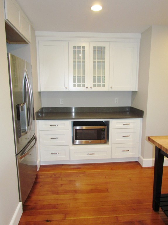 185 First Parish Road Scituate, MA 02066 - Photo 11 of 28 a kitchen with stainless steel appliances a stove a microwave and a refrigerator