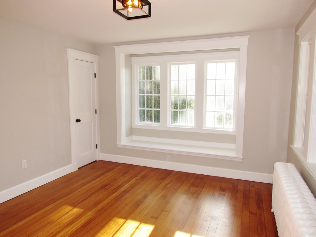 185 First Parish Road Scituate, MA 02066 - Photo 13 of 28 a view of empty room with wooden floor and fan