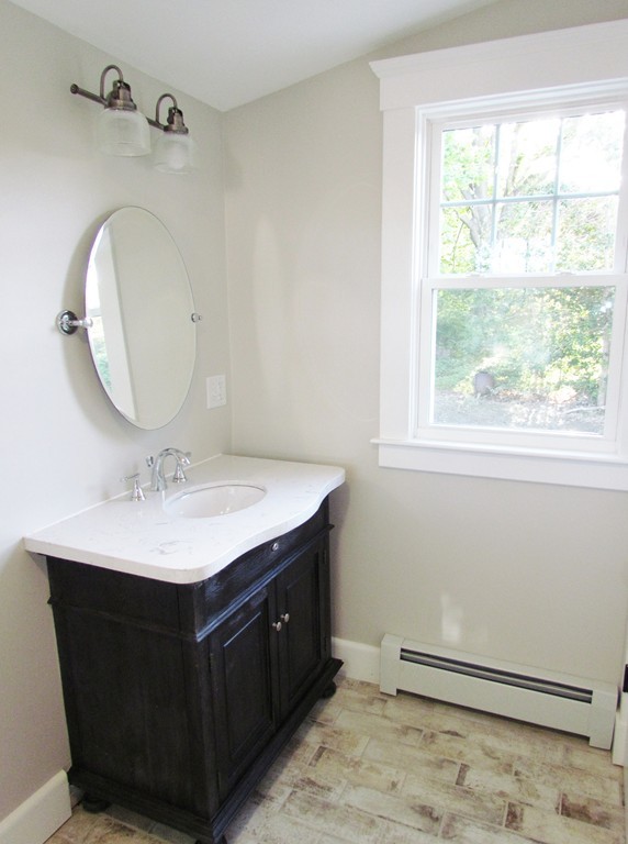 185 First Parish Road Scituate, MA 02066 - Photo 15 of 28 a bathroom with a sink and a mirror