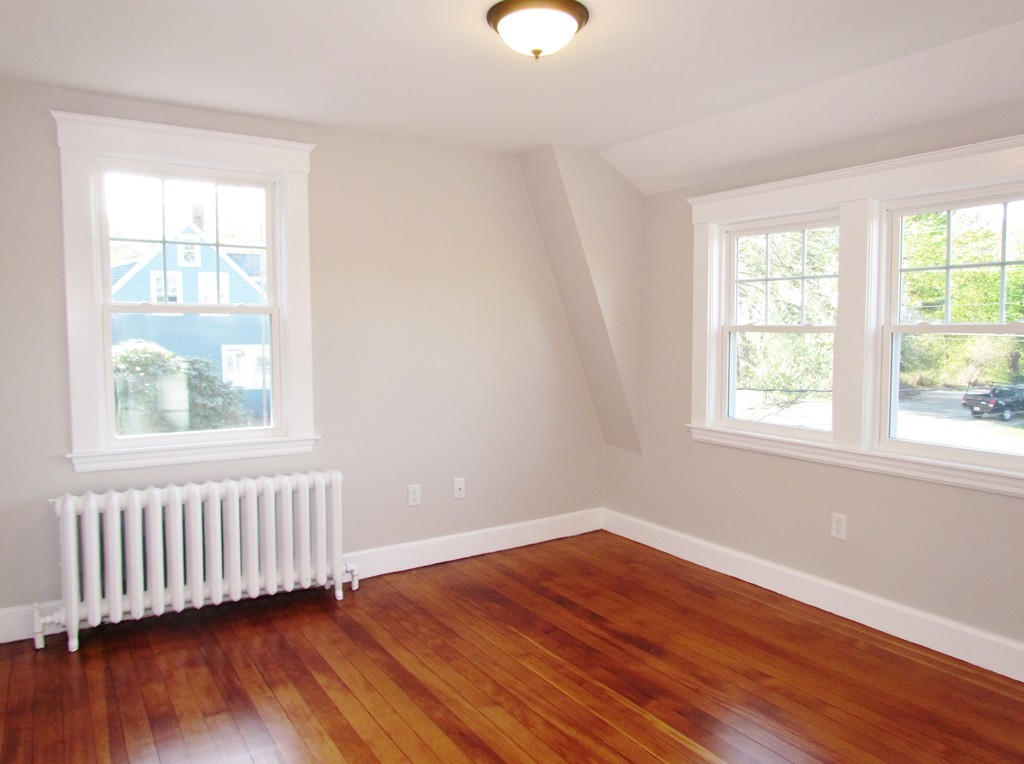 185 First Parish Road Scituate, MA 02066 - Photo 24 of 28 a view of an empty room with wooden floor and a window