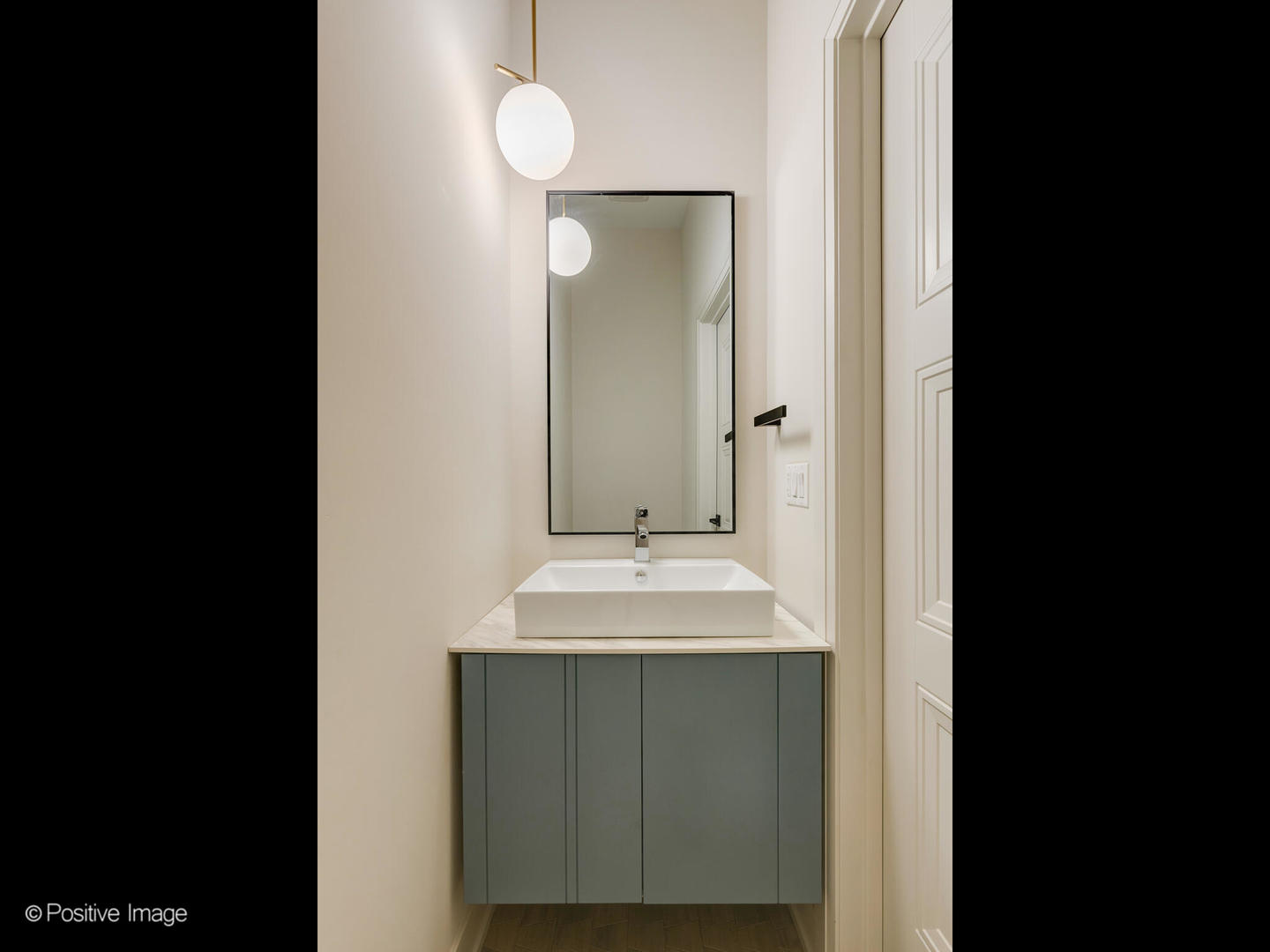 3205 North Kildare Avenue Chicago, IL 60641 - Photo 20 of 33 a bathroom with a sink and a mirror