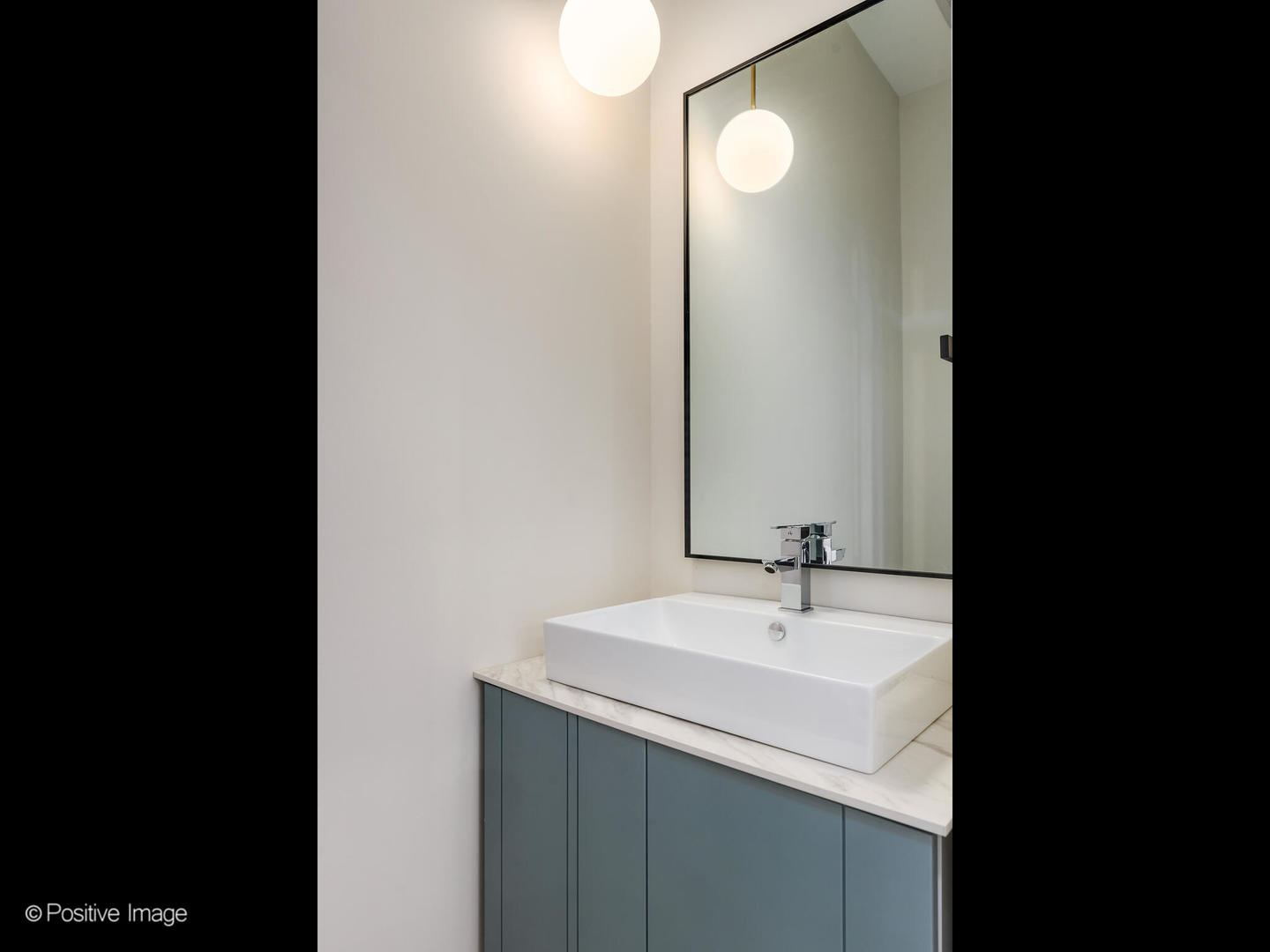 3205 North Kildare Avenue Chicago, IL 60641 - Photo 21 of 33 a bathroom with a sink and a mirror