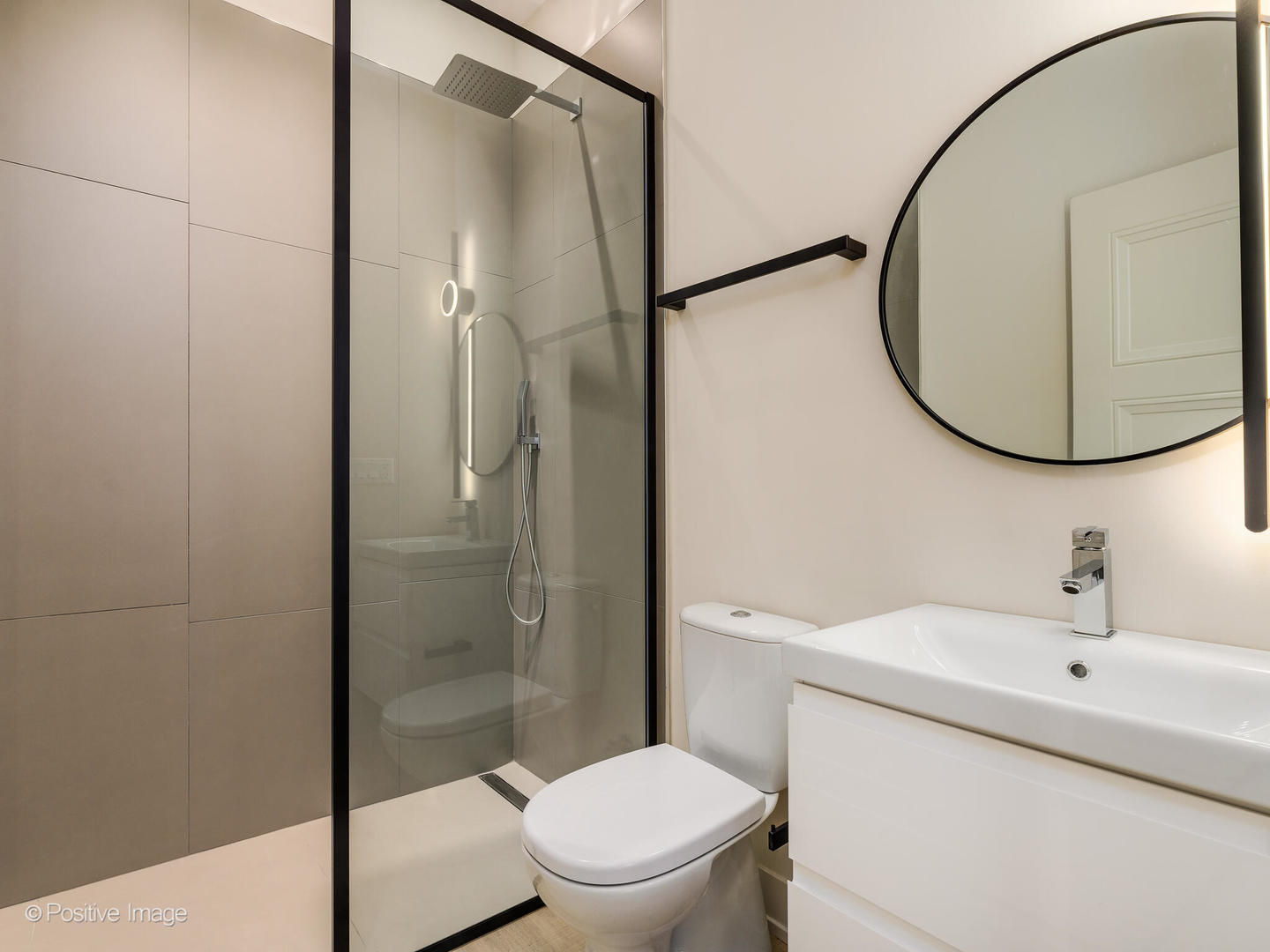 3205 North Kildare Avenue Chicago, IL 60641 - Photo 30 of 33 a bathroom with a toilet a sink and a mirror
