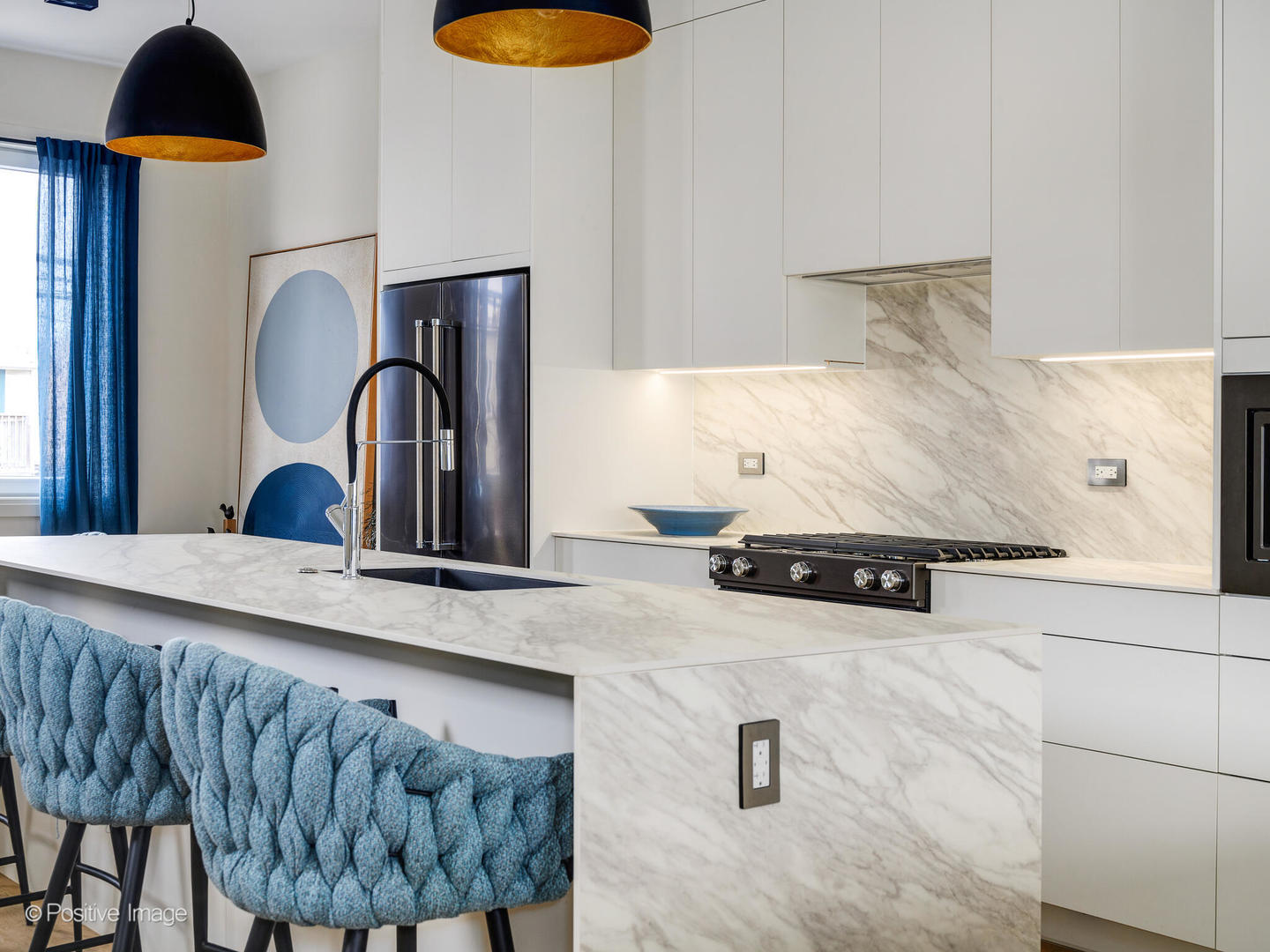 3205 North Kildare Avenue Chicago, IL 60641 - Photo 6 of 33 a kitchen with a sink a stove and chairs with wooden floor