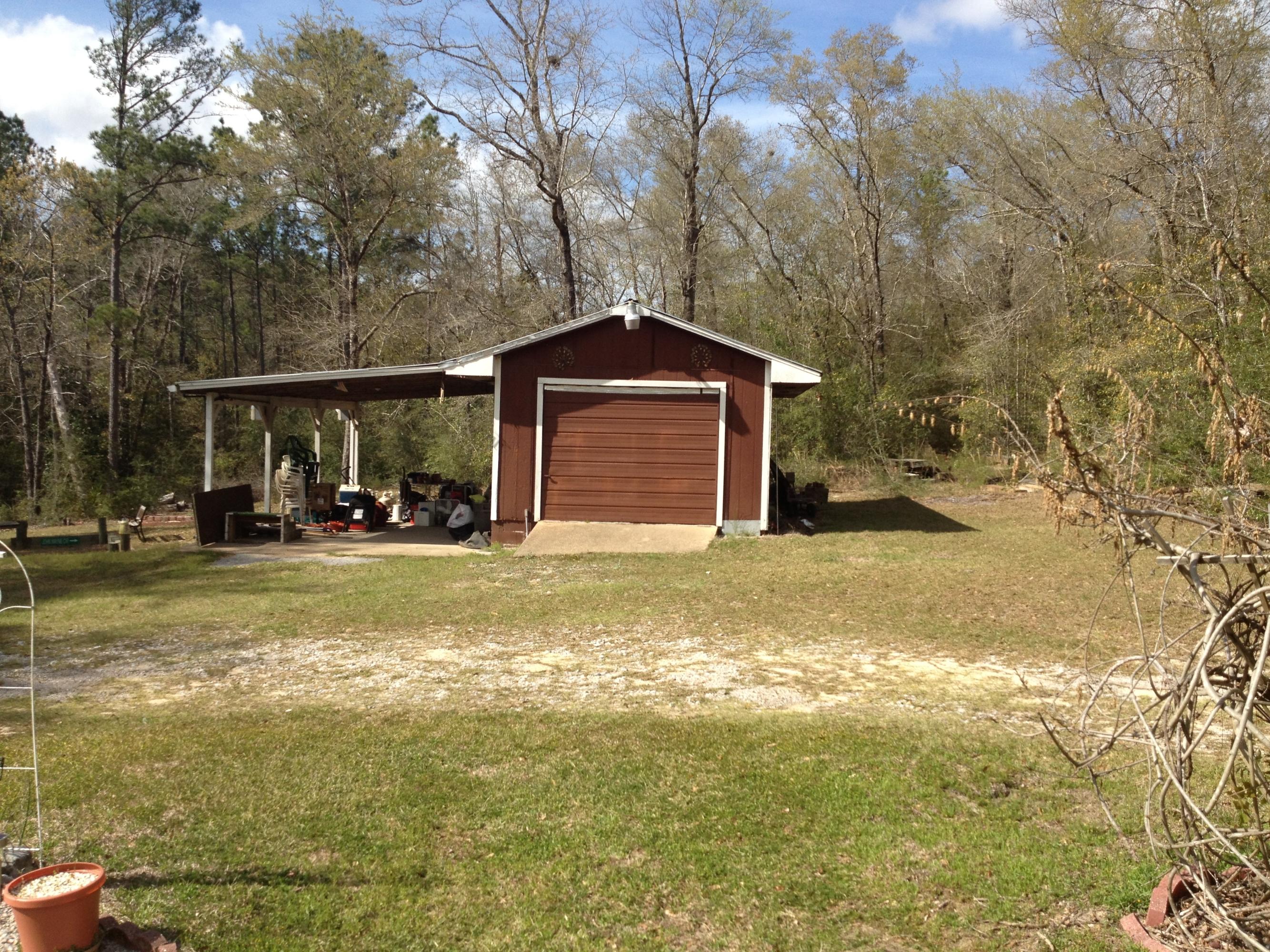 4217 Poverty Creek Road Crestview, FL 32539 - Photo 2 of 8 a front view of a house with a yard