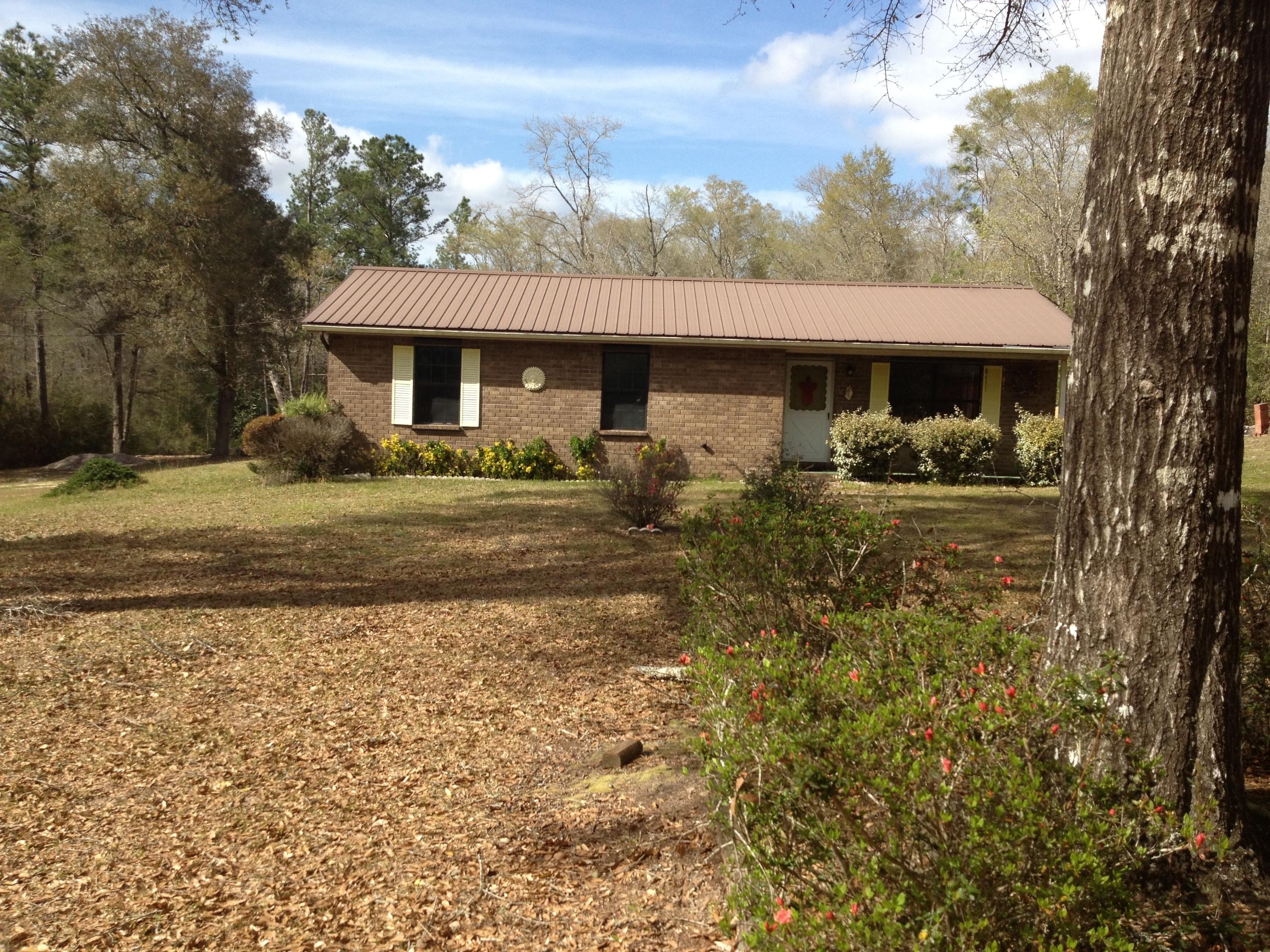 4217 Poverty Creek Road Crestview, FL 32539 - Photo 7 of 8 a front view of a house with a yard