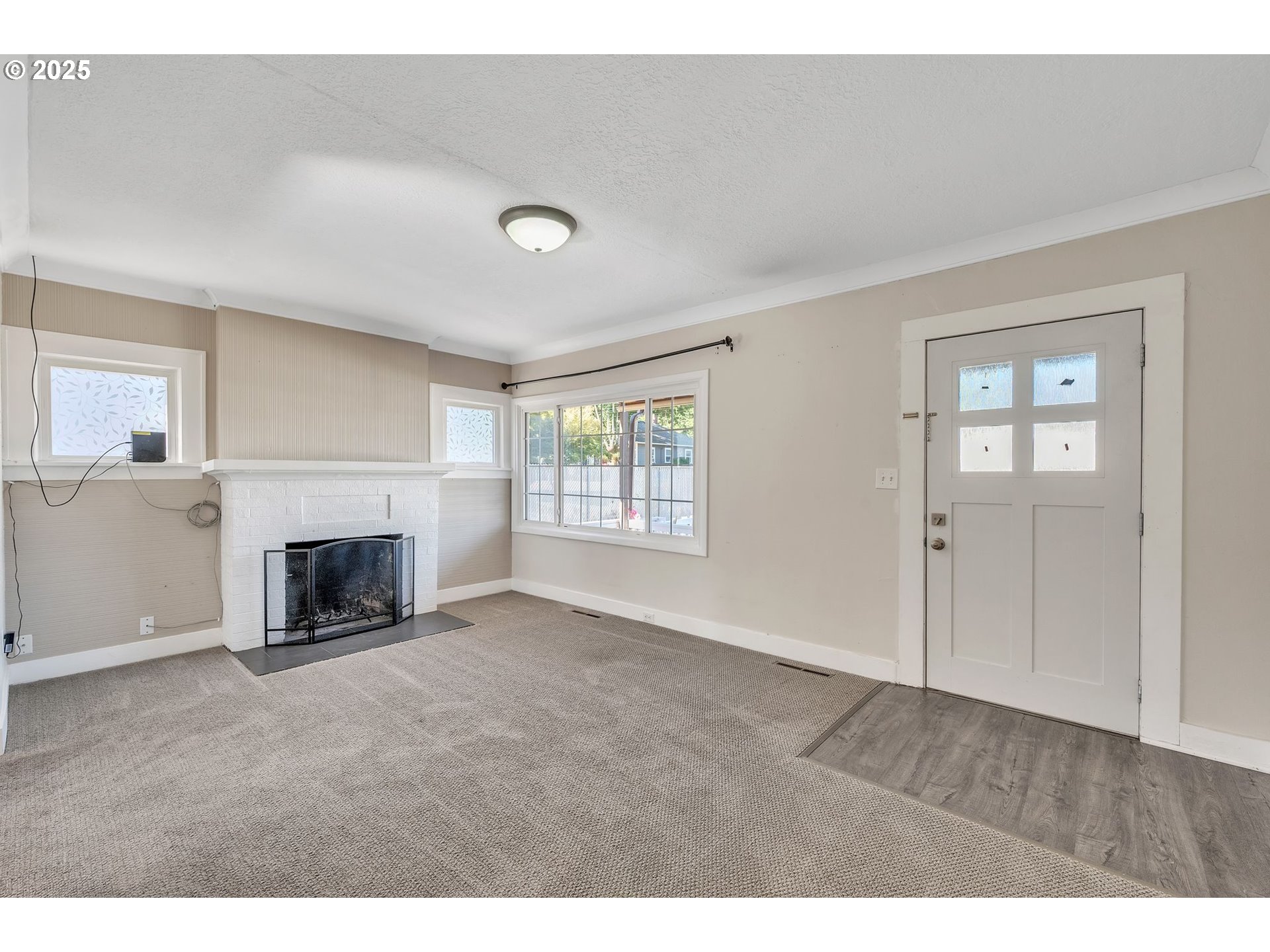 420 Southeast Linden Avenue Gresham, OR 97080 - Photo 15 of 30 a view of a livingroom with a fireplace cabinet and window