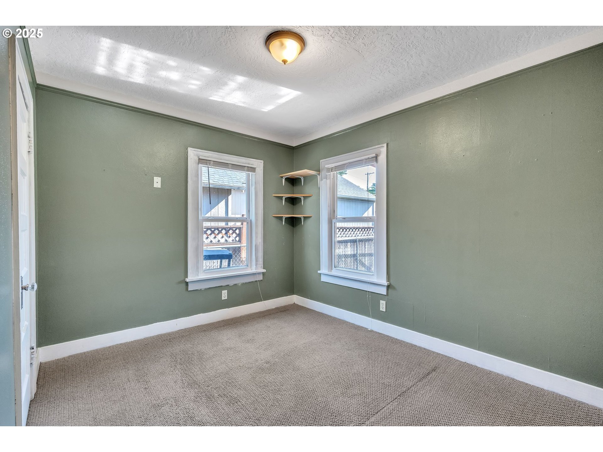 420 Southeast Linden Avenue Gresham, OR 97080 - Photo 29 of 30 a view of an empty room with window and hardwood floor