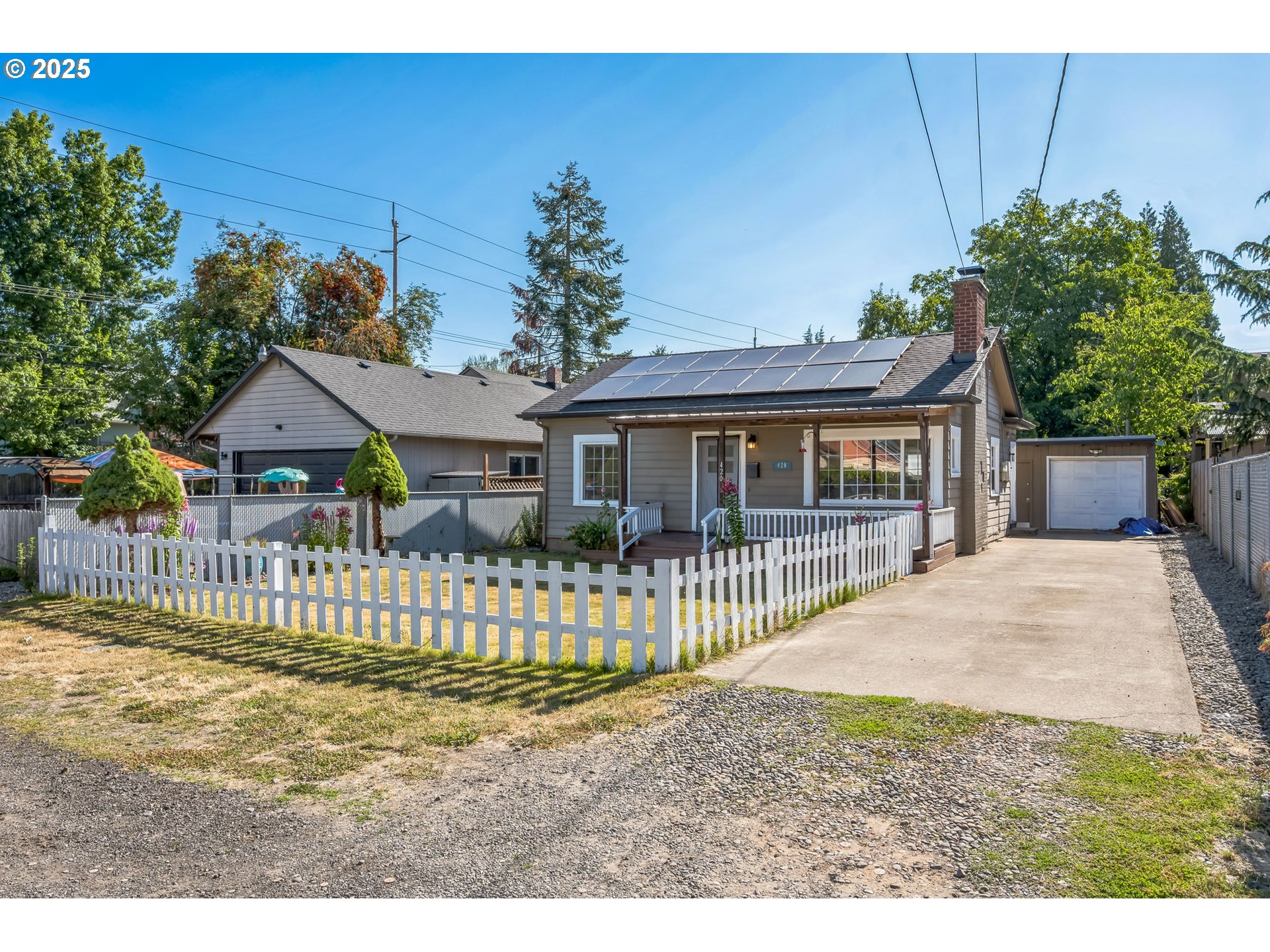 420 Southeast Linden Avenue Gresham, OR 97080 - Photo 3 of 30 a front view of a house with a garden
