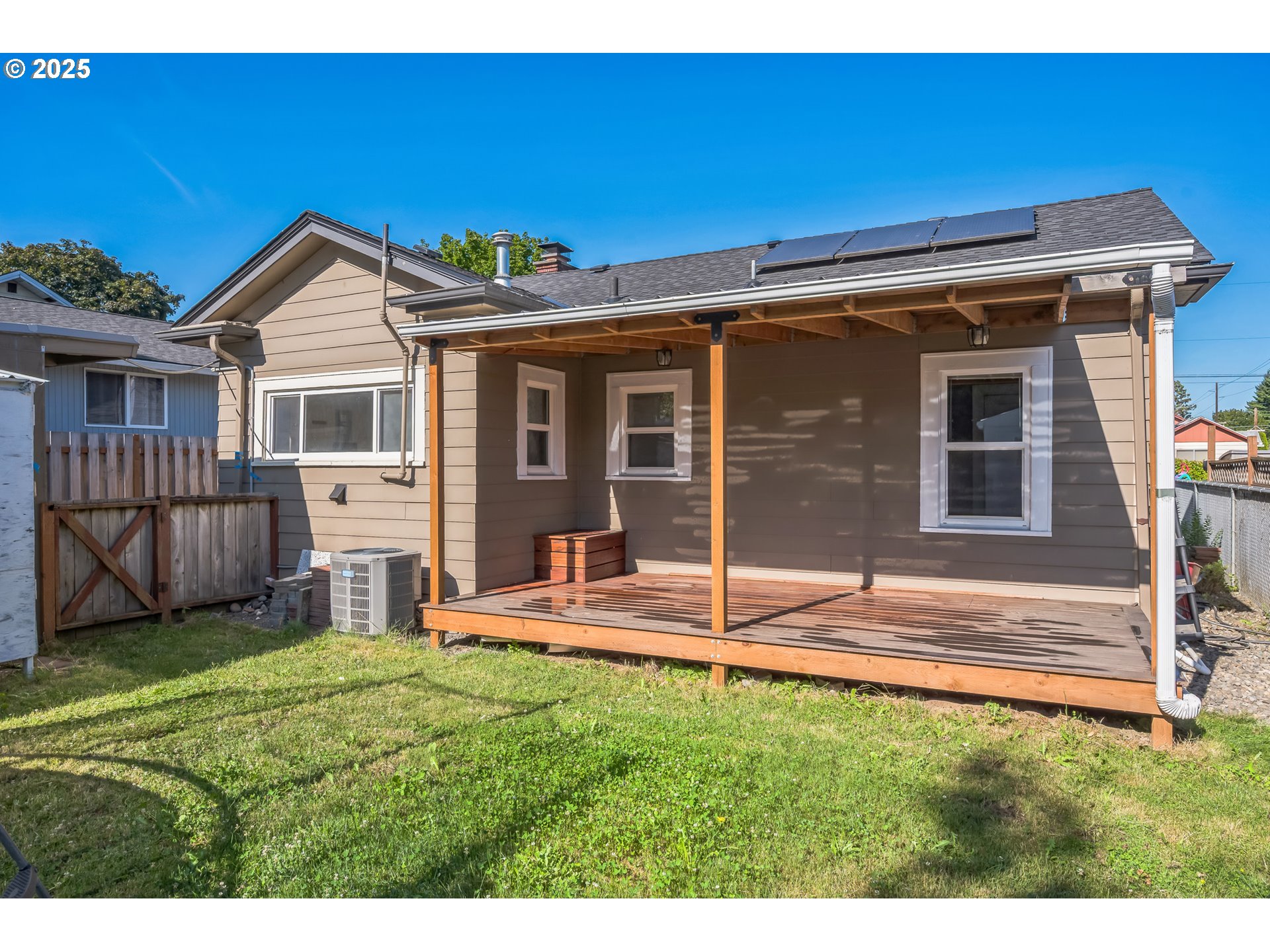 420 Southeast Linden Avenue Gresham, OR 97080 - Photo 7 of 30 a view of a house with a yard and a porch