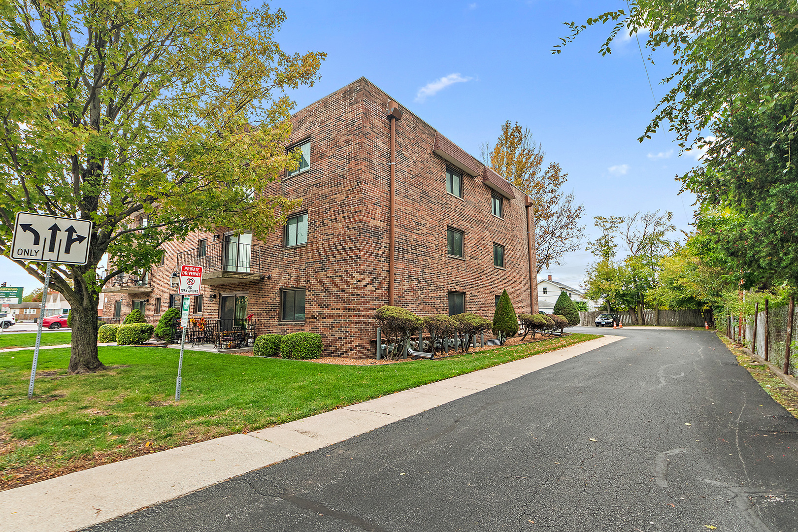 1940 183rd Street, Unit 1C Homewood, IL 60430 - Photo 2 of 16 a view of a building with a yard