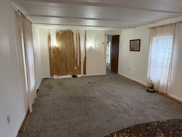 a view of a room with wooden walls